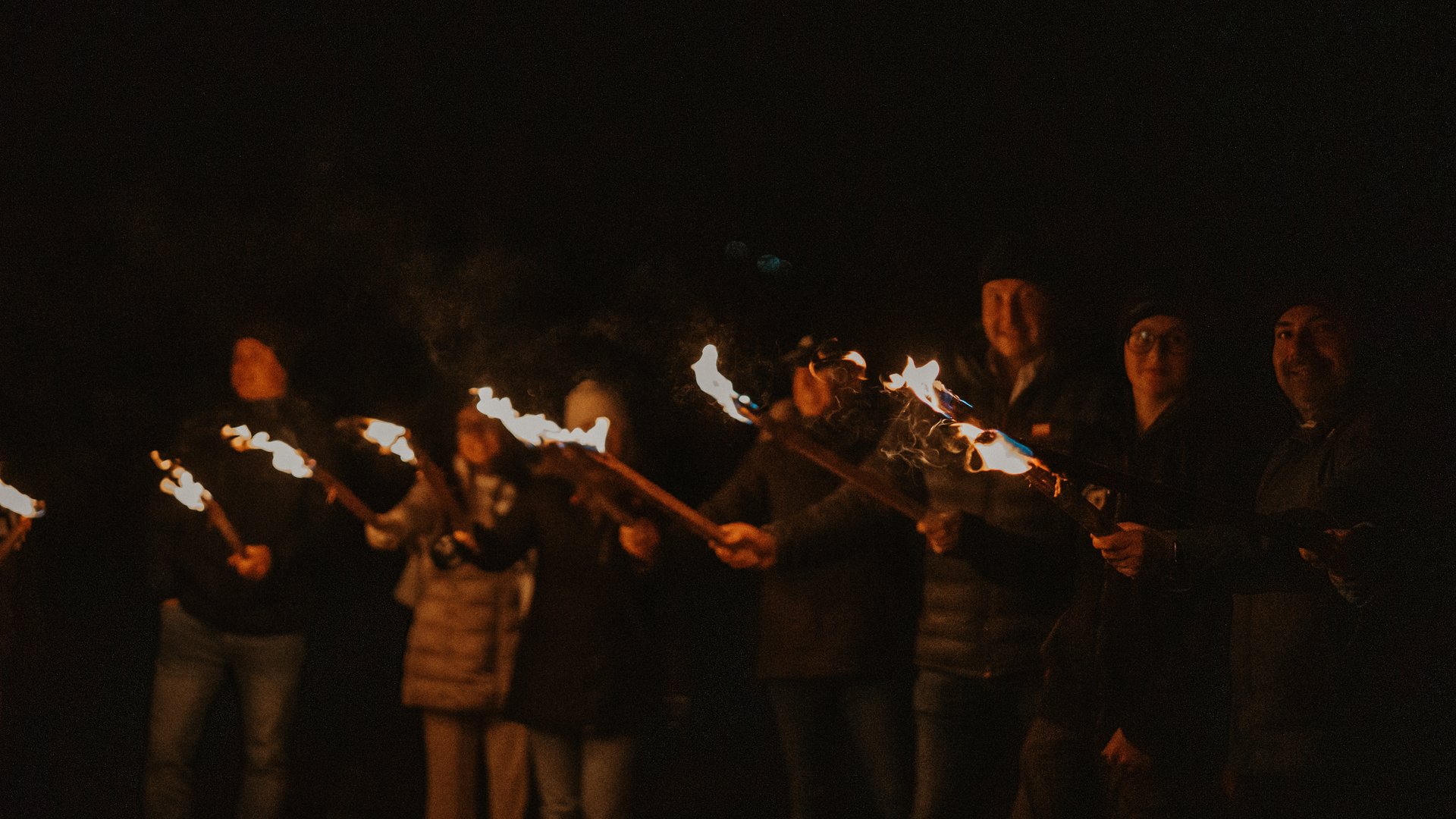 Our hiking and wellness hotel near Sterzing: Lahnerhof Group of people at night holding lit torches