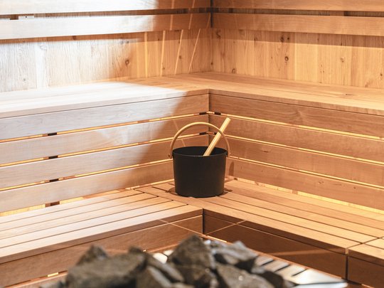 Our hiking and wellness hotel near Sterzing: Lahnerhof Wooden sauna with benches, bucket and ladle, window on the wall