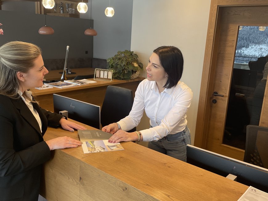 Holiday at Monte Cavallo/Rosskopf, Sterzing: hotel Lahnerhof Two women talking at a hotel or office reception desk